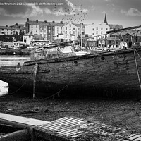 Buy canvas prints of Wrecked old boat opposite Caernarfon Castle by Jules D Truman