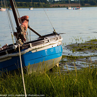 Buy canvas prints of small boat at low tide manningtree essex by Michael bryant Tiptopimage