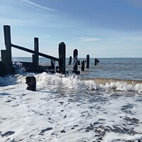 Buy canvas prints of Waves Rolling over the Groyne  by Mark Ritson