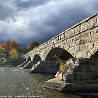 Buy canvas prints of Pakenham 5 Arch Stone Bridge in Autumn by Jim Cumming