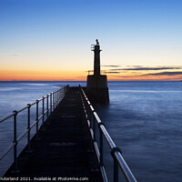 Buy canvas prints of Harbour Light Silhouette against Dawn Sky by Mark Sunderland