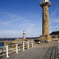 Buy canvas prints of West and East Pier Lighthouses at Whitby by Mark Sunderland