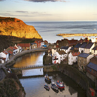 Buy canvas prints of Staithes at Sunset North Yorkshire England by Mark Sunderland
