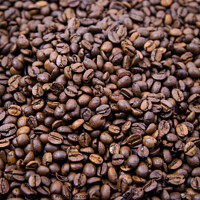 Buy canvas prints of top view of fresh roasted coffee beans background. Background of roasted coffee beans	 by Emils Vanags