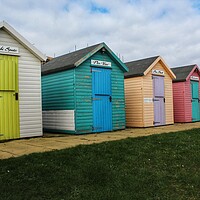Buy canvas prints of Amble Beach Huts  by ami Photography