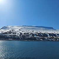 Buy canvas prints of Serene Winter Landscape: Majestic Mountains, Pristine Snow, and Tranquil Sea a view from svalbard and jan mayen norway by Anish Punchayil Sukumaran