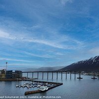 Buy canvas prints of Gleaming Tromso Bridge Reflecting Clouds over the Sea by Anish Punchayil Sukumaran