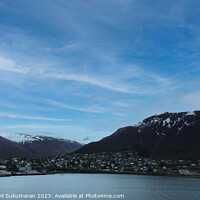 Buy canvas prints of Snowy Tranquil Mountain Lake in Tromso, Norway by Anish Punchayil Sukumaran