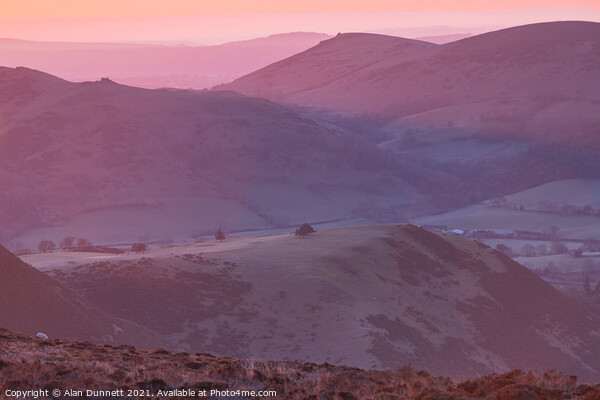 Sunrise from the Long Mynd over the Shropshire Hil Picture Board by Alan Dunnett