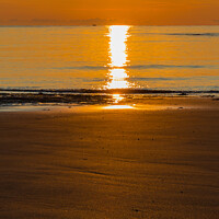 Buy canvas prints of Sunrise and glitter on Embleton Beach, Northumbria by Alan Dunnett