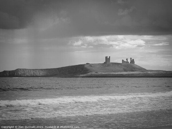 Rain and Dunstanburgh Picture Board by Alan Dunnett