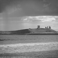 Buy canvas prints of Rain and Dunstanburgh by Alan Dunnett