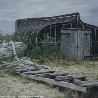 Buy canvas prints of Holy Island Boat shed by Alan Dunnett