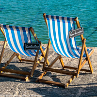 Buy canvas prints of A pair of blue striped deckchairs with reserved signs, St. Ives harbour, Cornwall by Photimageon UK