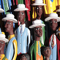 Buy canvas prints of Colorful African Carved Figures by Neil Overy