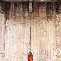 Buy canvas prints of An old lantern hangs against a wall, Corfu, Greece by Neil Overy