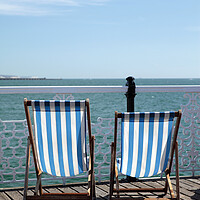 Buy canvas prints of Pair of Deckchairs on Brighton Pier by Neil Overy