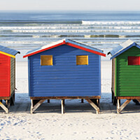 Buy canvas prints of Colourful Beach Huts at Muizenberg Beach, South Africa by Neil Overy