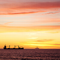 Buy canvas prints of Sunset over ships waiting to enter Cape Town Harbour, South Africa by Neil Overy