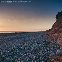 Buy canvas prints of Sunset on red cliffs at Walney Island by Michaela Strickland