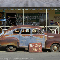 Buy canvas prints of Rusting relic outside antiques shop by Adrian Turnbull-Kemp