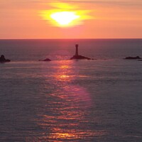 Buy canvas prints of Sunset at the iconic Lands End Cornwal by Deborah Welfare