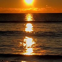 Buy canvas prints of Sun rise reflection on sea by Deborah Welfare