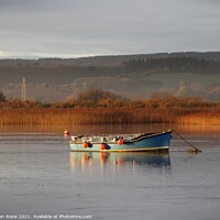 Buy canvas prints of Blue boat on the Exe Estuary in early morning winter sunlight by Joan Rosie