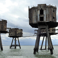 Buy canvas prints of Five rusting Maunsell Forts in the Thames Estuary near Whitstable by Joan Rosie