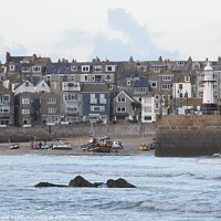 Buy canvas prints of Close-up view of buildings and lighthouse in St Ives, Cornwall by Joan Rosie