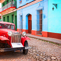 Buy canvas prints of Trinidad, Cuba. Old vintage car in a street by Delphimages Art