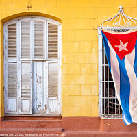 Buy canvas prints of Cuban flag in in a street of Trinidad, Cuba by Delphimages Art