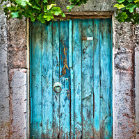 Buy canvas prints of Old blue door in a village in Turkey by Delphimages Art