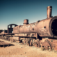 Buy canvas prints of Old rusty train cemetery in Uyuni, Bolivia by Delphimages Art