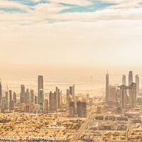 Buy canvas prints of Dubai skyline panorama, aerial view at sunset by Delphimages Art