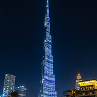 Buy canvas prints of Dubai. Burj Khalifa tower at night, UAE by Delphimages Art