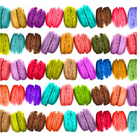 Buy canvas prints of Rows of brightly colored French macarons cookies by Delphimages Art