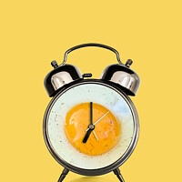 Buy canvas prints of Breakfast time, fried egg and vintage alarm clock  by Delphimages Art