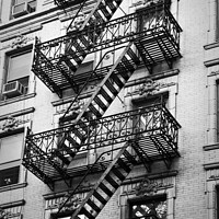 Buy canvas prints of New York. Exit, fire escape stairs in Manhattan by Delphimages Art