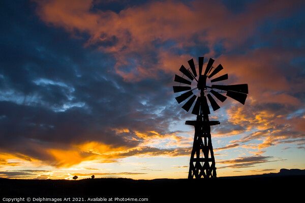 American windmill at sunset, dramatic sky Picture Board by Delphimages Art
