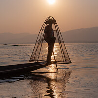 Buy canvas prints of Myanmar. Fisherman on Inle lake at sunset, Burma by Delphimages Art