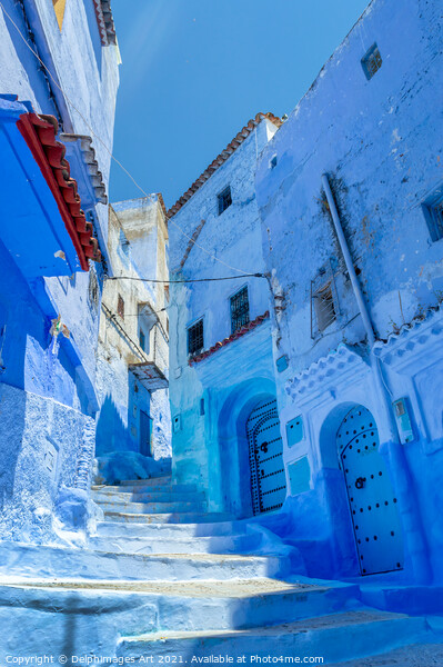 Street in the blue city of Chefchaouen in Morocco Picture Board by Delphimages Art