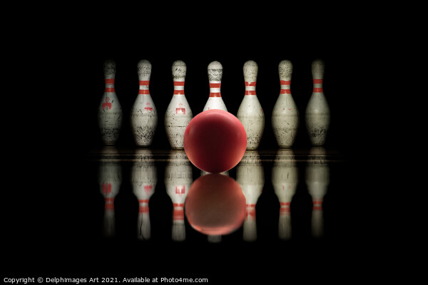 Strike, bowling ball and pins aligned on black  Picture Board by Delphimages Art