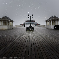 Buy canvas prints of Flurry. Snowfall on Cromer Pier, Norfolk  by Martin Tosh