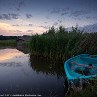 Buy canvas prints of Morning Hickling - Thatched boat shed and rowing boat by Martin Tosh