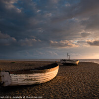 Buy canvas prints of Ready. Old rowing boats on shingle beach by Martin Tosh