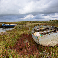Buy canvas prints of Old rowing boat on marsh grass by Martin Tosh