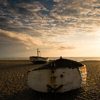 Buy canvas prints of Ready ii. Old rowing boats on shingle beach by Martin Tosh