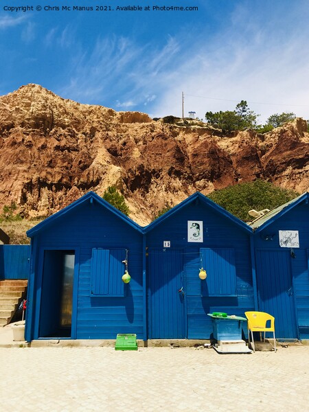 Colourful Beach Huts on Algarves Golden Cliffs Picture Board by Chris Mc Manus