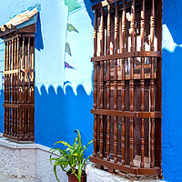 Buy canvas prints of Colombia, Scenic colorful streets of Cartagena in historic Getsemani district near Walled City, Ciudad Amurallada, a UNESCO world heritage site by Elijah Lovkoff